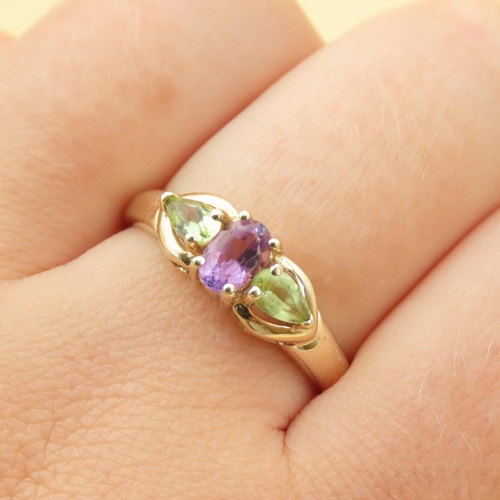 86 - Green and Purple Amethyst Three Stone Ring Mounted on 9 Carat Yellow Gold Band Ring Size R