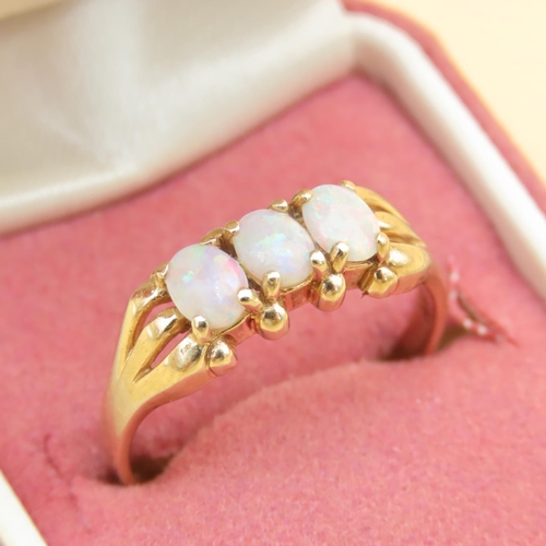 88 - Opal Three Stone Ring Mounted on 9 Carat Yellow Gold Band Ring Size R