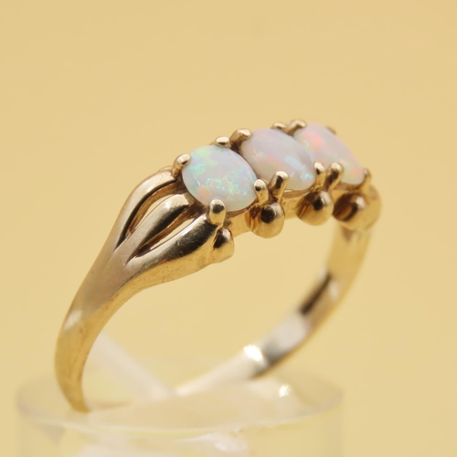 88 - Opal Three Stone Ring Mounted on 9 Carat Yellow Gold Band Ring Size R