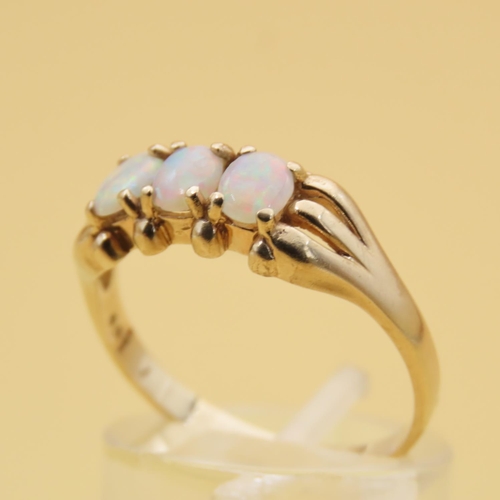 88 - Opal Three Stone Ring Mounted on 9 Carat Yellow Gold Band Ring Size R