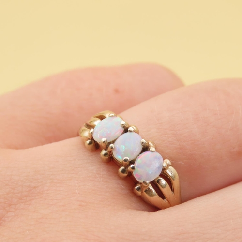 88 - Opal Three Stone Ring Mounted on 9 Carat Yellow Gold Band Ring Size R