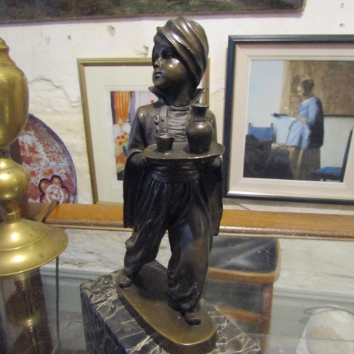 127 - Bronze Sculpture Servant Boy with Turban Mounted on Tube Form Model Base Approximately 9 Inches High