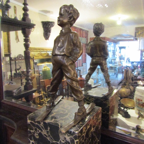 231 - Bronze Sculpture Boy Skier Mounted on Tube Form Marble Base Approximately 9 Inches High