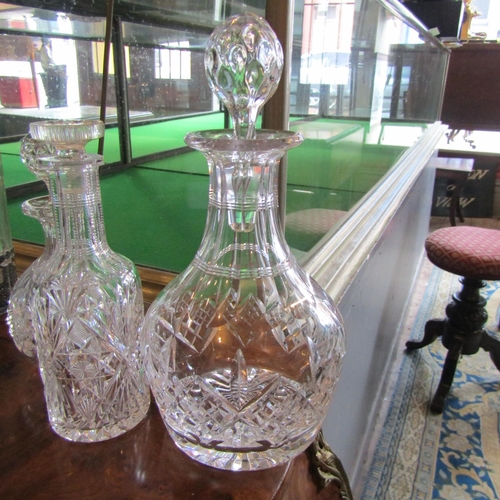 70 - Three Cut Crystal Decanters with Original Stoppers