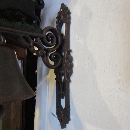 81 - Painted Iron Wall Mounted Bell with Canin Motif