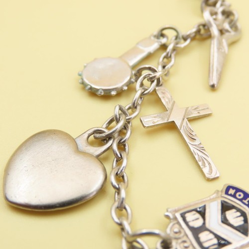 1044 - Silver Charm Bracelet Laden with Various Charms Including Crucifix, Love Heart, Floral Basket, etc 1... 