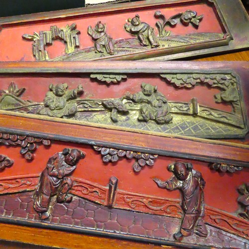 100L - Three Oriental Carved Wooden and Gilded Inset Panels Red Ground Each Approximately 14 Inches Wide