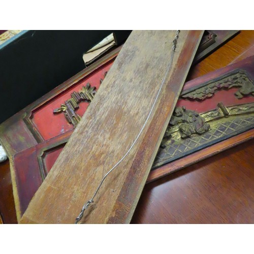 100L - Three Oriental Carved Wooden and Gilded Inset Panels Red Ground Each Approximately 14 Inches Wide