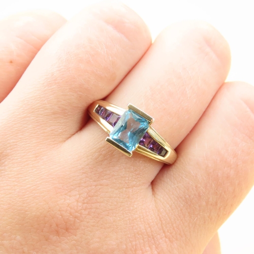 104 - Emerald Cut Bar Set Blue Topaz and Amethyst Ring Mounted on 9 Carat Yellow Gold Band Size S