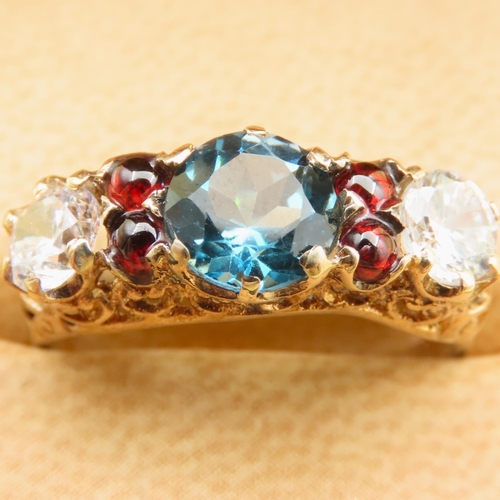 121 - Blue Topaz White Topaz and Red Garnet Stone Ring Further Set Mounted on 9 Carat Yellow Gold Band Siz... 