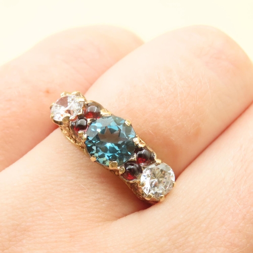 121 - Blue Topaz White Topaz and Red Garnet Stone Ring Further Set Mounted on 9 Carat Yellow Gold Band Siz... 