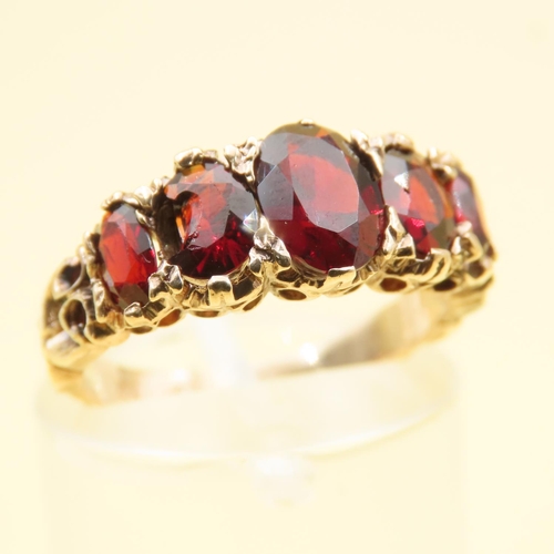 122 - Five Stone Red Garnet Ring Mounted on 9 Carat Yellow Gold Band Size J 0.5