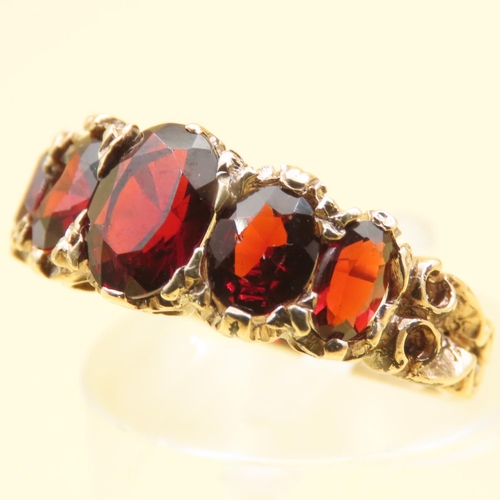 122 - Five Stone Red Garnet Ring Mounted on 9 Carat Yellow Gold Band Size J 0.5