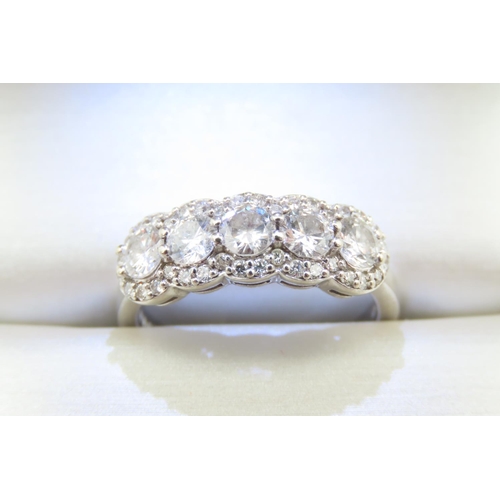 124 - Five Stone Diamond Ring with Further Diamond Inset to 18 Carat White Gold Band Ring Size M