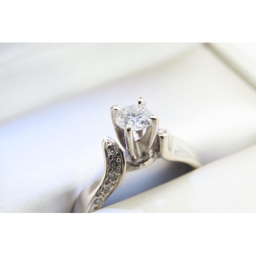 125 - 18 Carat White Gold Diamond Solitaire Ring with Further Diamonds to Shoulders Ring Size N