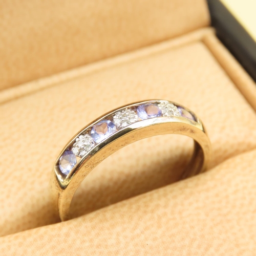 134 - Tanzanite and Diamond Channel Set Half Eternity Ring Mounted on 9 Carat Yellow Gold Band Size S