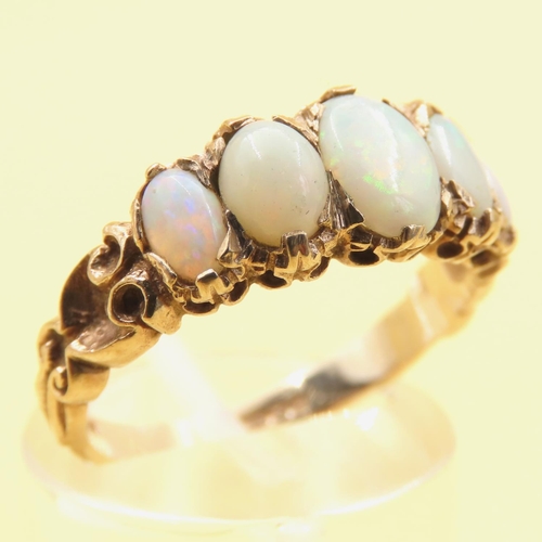 146 - Five Stone Opal Ring Mounted on 9 Carat Yellow Gold Band Size P