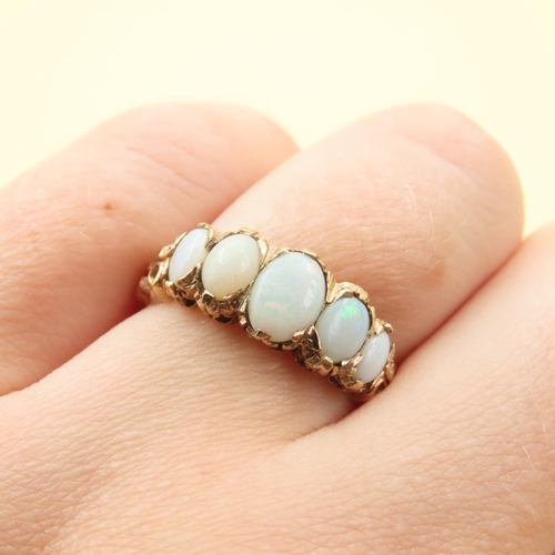 146 - Five Stone Opal Ring Mounted on 9 Carat Yellow Gold Band Size P