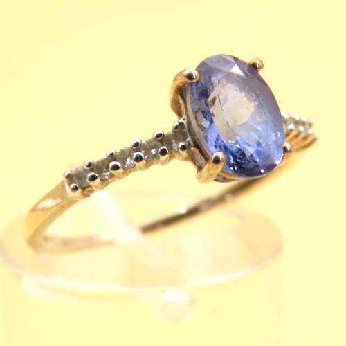 154 - Tanzanite Solitaire Ring with Further Pave Set Diamonds on the Band Mounted on a 9 Carat Yellow Gold... 