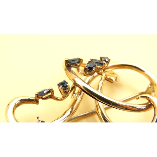 168 - 18 Carat Yellow Gold Six Stone Sapphire Set Ladies Brooch Shaped Form 5cm Wide x 4cm High