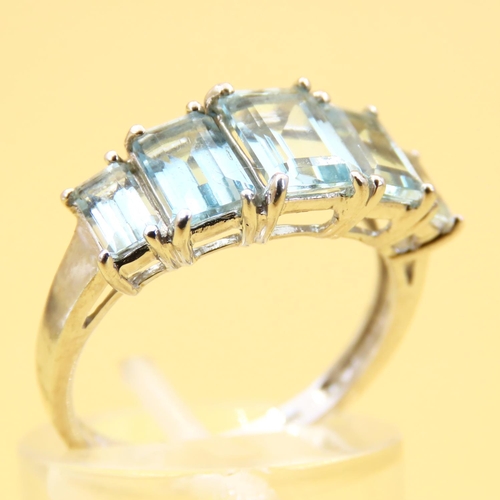 17 - Five Stone Emerald Cut Aquamarine Ring Set in 9 Carat White Gold Band Ring Size N