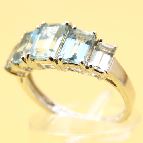 17 - Five Stone Emerald Cut Aquamarine Ring Set in 9 Carat White Gold Band Ring Size N