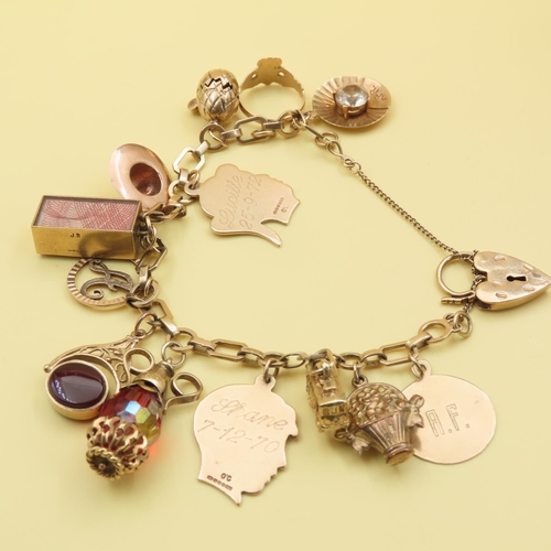 178 - 9 Carat Yellow Gold Charm Bracelet Laden with Various Charms Bracelet 17.5cm Long Weight 43 Grams
