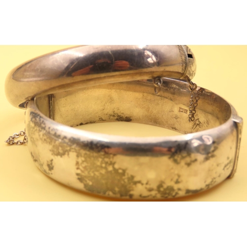 195 - Two Silver Ladies Wrist Bangles Hinge Form Incised Detailing to Both Inner Width 7cm Each