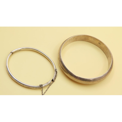 200 - Two Silver Bangles Hinge Form 7cm and 6.5cm Inner Diameter