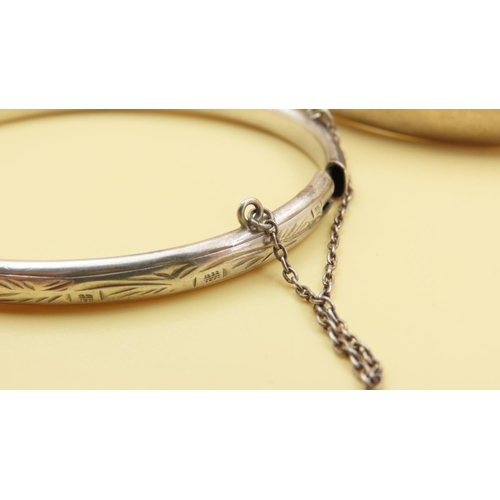 200 - Two Silver Bangles Hinge Form 7cm and 6.5cm Inner Diameter