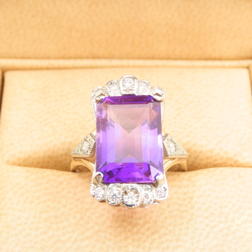 218 - Amethyst and Diamond Ladies Ring Mounted on 9 Carat Yellow Gold Band Ring Size O