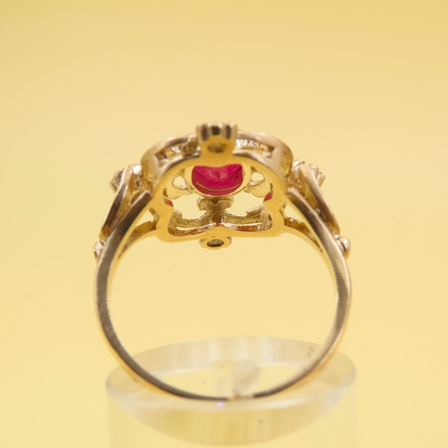 224 - Ruby and Diamond Set Ladies Ring Mounted on 9 Carat Yellow Gold Band Attractively Detailed Ring Size... 