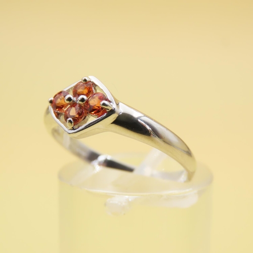 253 - Four Stone Orange Sapphire Set Ring Mounted on 9 Carat White Gold Band Size N