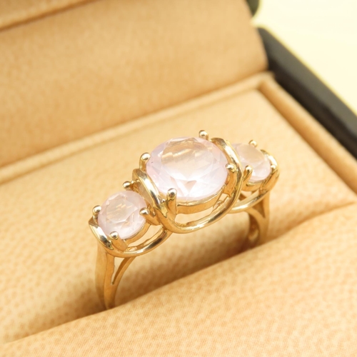 255 - Three Stone Rose Quartz Ring Mounted on 9 Carat Yellow Gold Band Size N