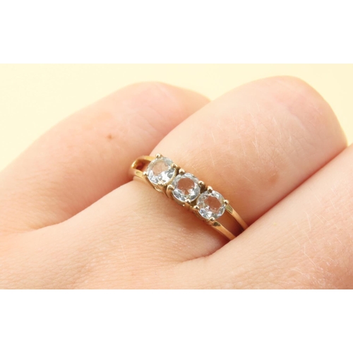 262 - Aquamarine Three Stone Ring Mounted on 9 Carat Yellow Gold Band Size N