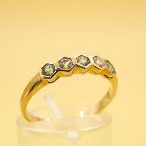 264 - Swiss Blue and White Topaz Set Five Stone Ring Mounted on a 9 Carat Yellow Gold Band Size N