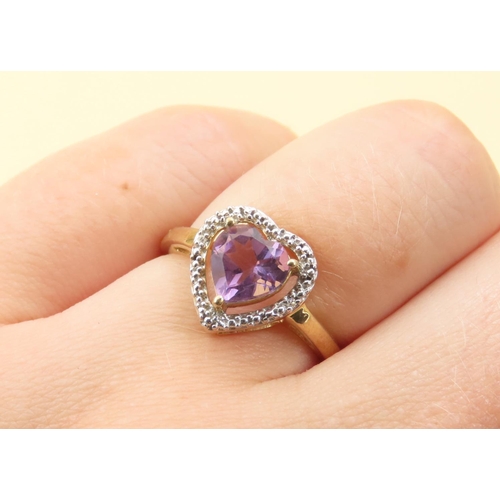 266 - Amethyst Heart Motif Ring with Diamond Halo Setting Mounted on 9 Carat Yellow Gold Band Size N