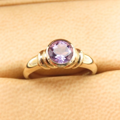 269 - Bezel Set Amethyst Solitaire Ring Mounted on 9 Carat Yellow Gold Band Size N