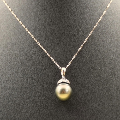 272 - Pearl and Diamond Set Pendant 18 Carat Gold  Mounted on 18 Carat White Gold Chain Pendant 1.7cm High