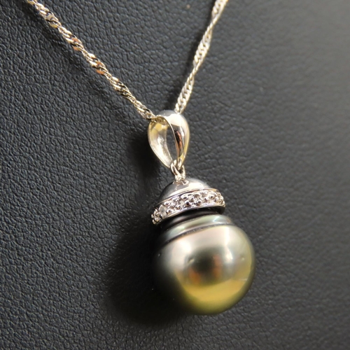 272 - Pearl and Diamond Set Pendant 18 Carat Gold  Mounted on 18 Carat White Gold Chain Pendant 1.7cm High