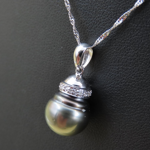 272 - Pearl and Diamond Set Pendant 18 Carat Gold  Mounted on 18 Carat White Gold Chain Pendant 1.7cm High