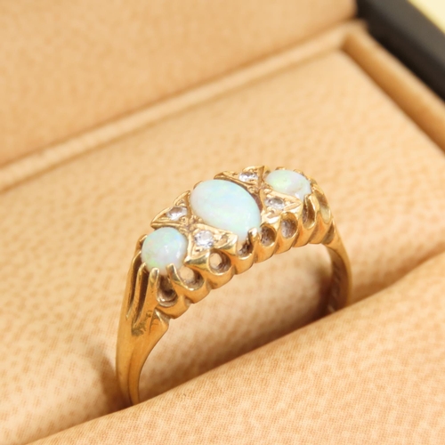 278 - Three Stone Opal and Diamond Rind Mounted on 18 Carat Yellow Gold Band Size M