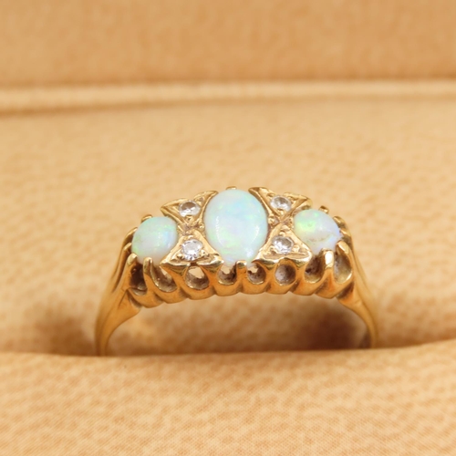 278 - Three Stone Opal and Diamond Rind Mounted on 18 Carat Yellow Gold Band Size M