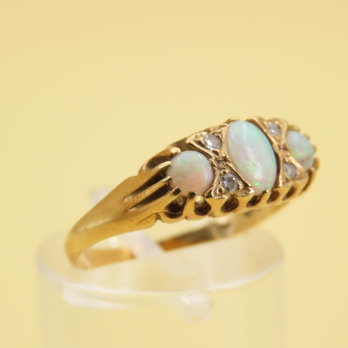 278 - Three Stone Opal and Diamond Rind Mounted on 18 Carat Yellow Gold Band Size M