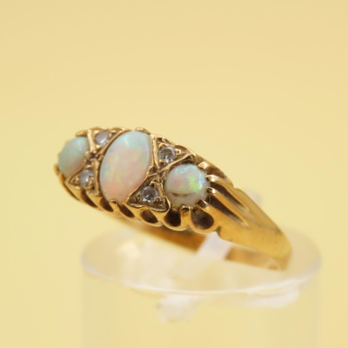 278 - Three Stone Opal and Diamond Rind Mounted on 18 Carat Yellow Gold Band Size M