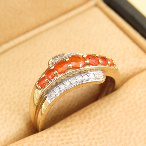 286 - Tangerine Garnet and Diamond Set Wrap Around Design Ring Mounted on 9 Carat Yellow Band Size Q