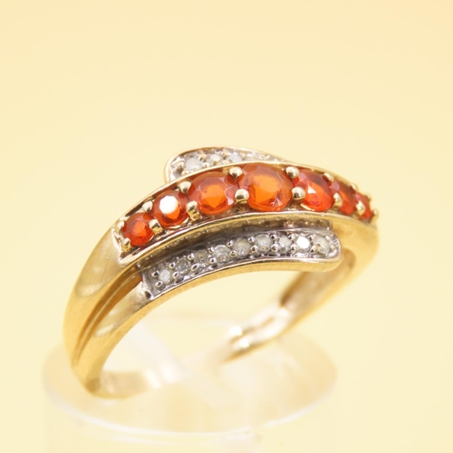 286 - Tangerine Garnet and Diamond Set Wrap Around Design Ring Mounted on 9 Carat Yellow Band Size Q