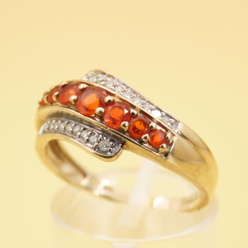 286 - Tangerine Garnet and Diamond Set Wrap Around Design Ring Mounted on 9 Carat Yellow Band Size Q