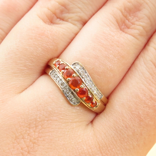 286 - Tangerine Garnet and Diamond Set Wrap Around Design Ring Mounted on 9 Carat Yellow Band Size Q