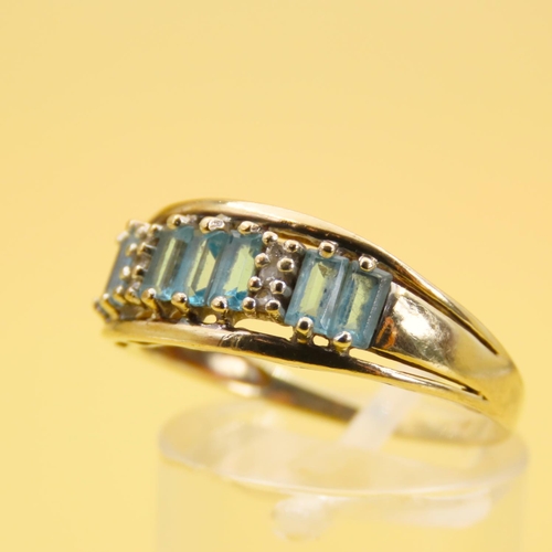 291 - Seven Stone Baguette Cut Aquamarine Ring with Diamond Insets Mounted on 9 Carat Yellow Gold Band Siz... 